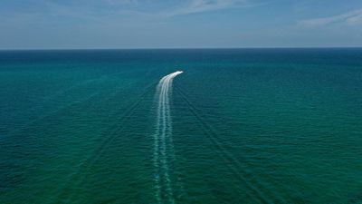 Image for story: Outrage sparked as Florida boaters caught on video dumping trash into ocean