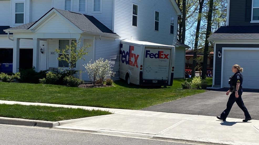Image for story: FedEx truck plows into Ohio home