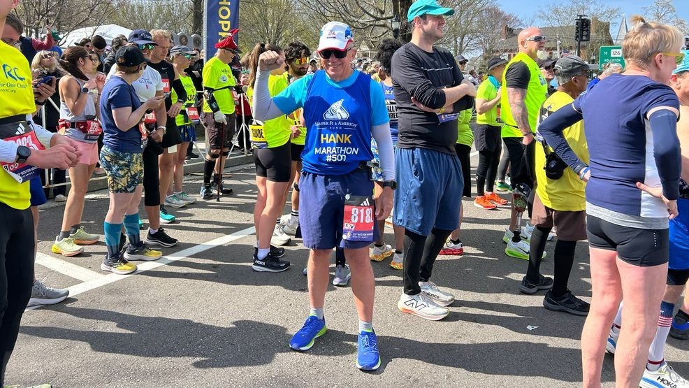Image for story: Retired Marine, cancer survivor conquers 500th marathon while helping wounded vets
