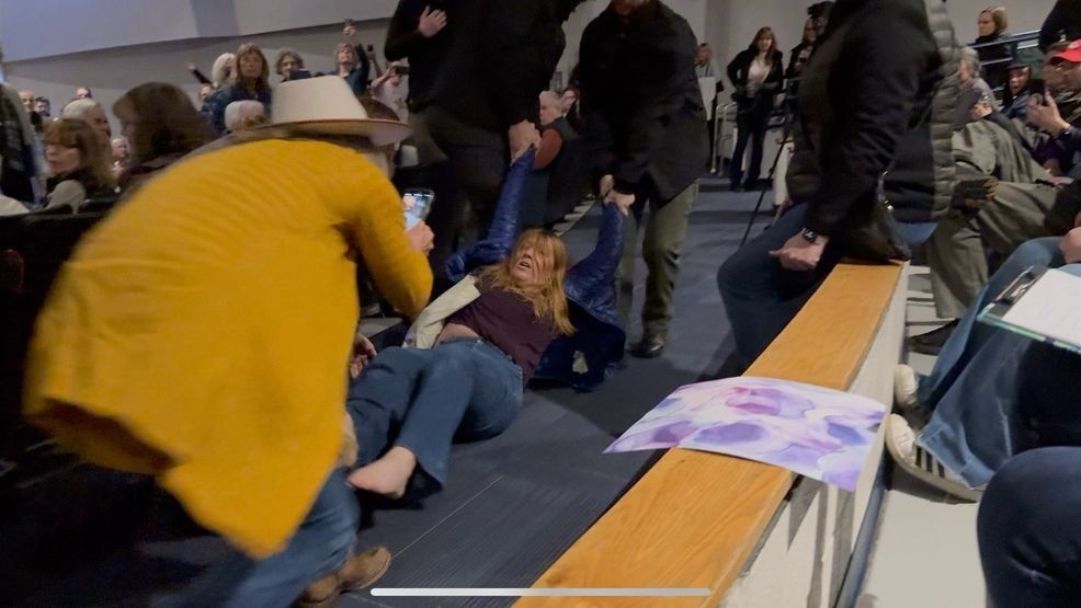 Image for story: Idaho Republican town hall turns chaotic as woman forcibly removed