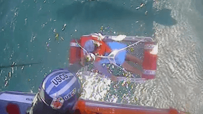 Image for story: Watch: 5 rescued after boat 'swamped' by wave in Lake Erie